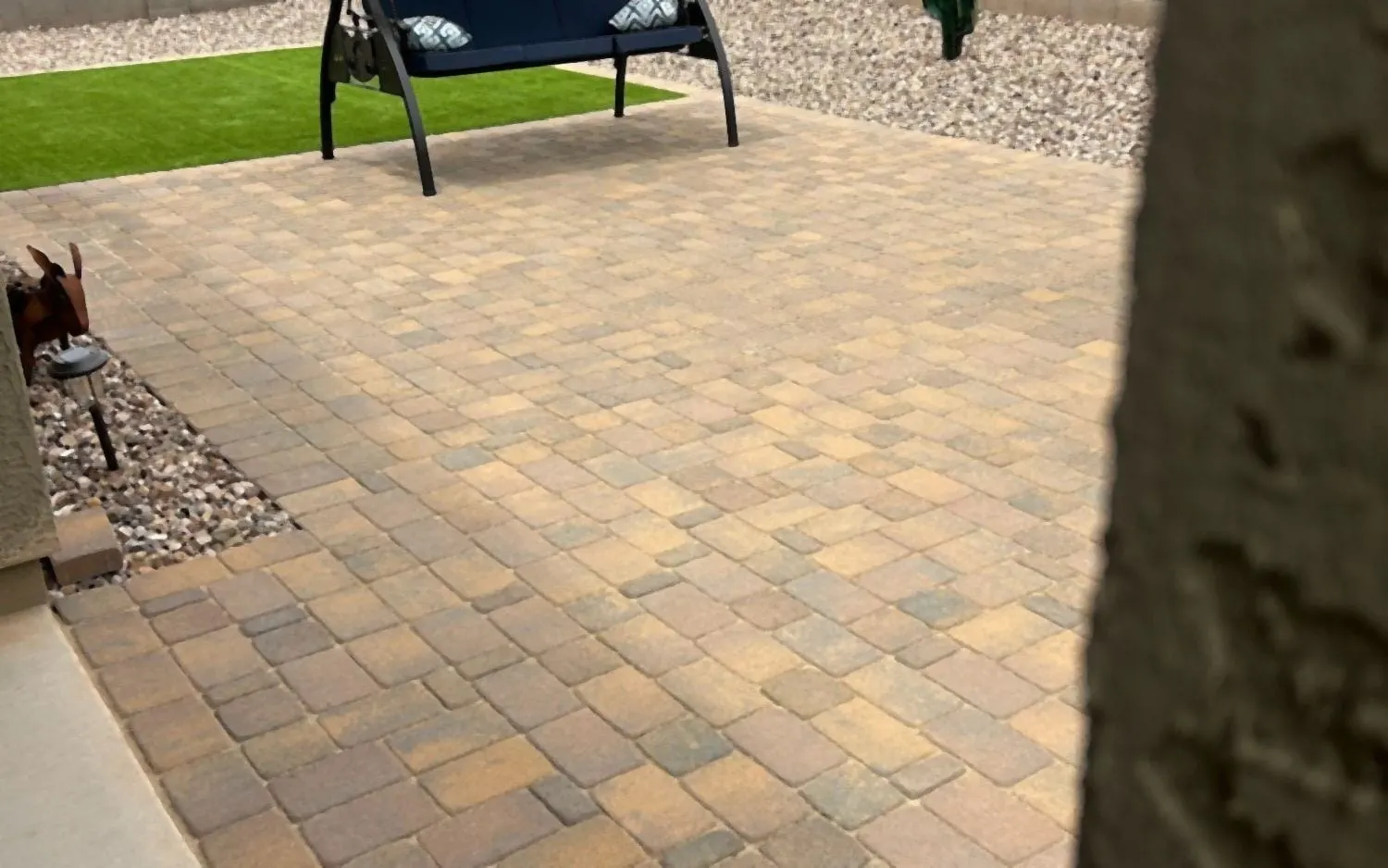 New paver patio in a backyard