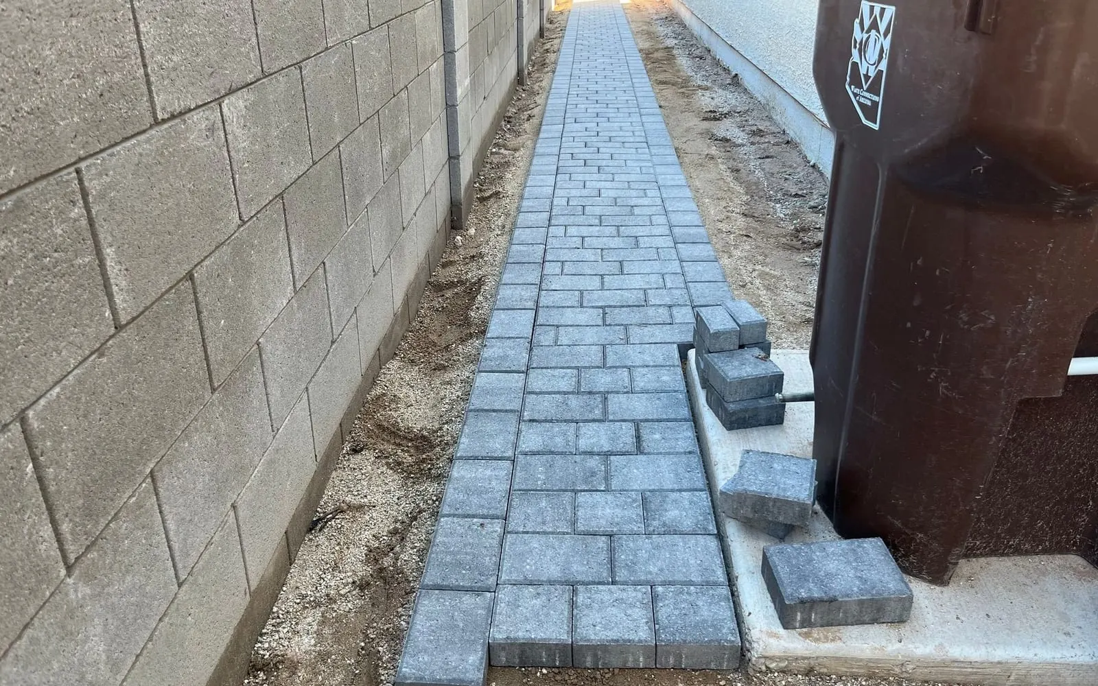 New paver walkway along a side yard